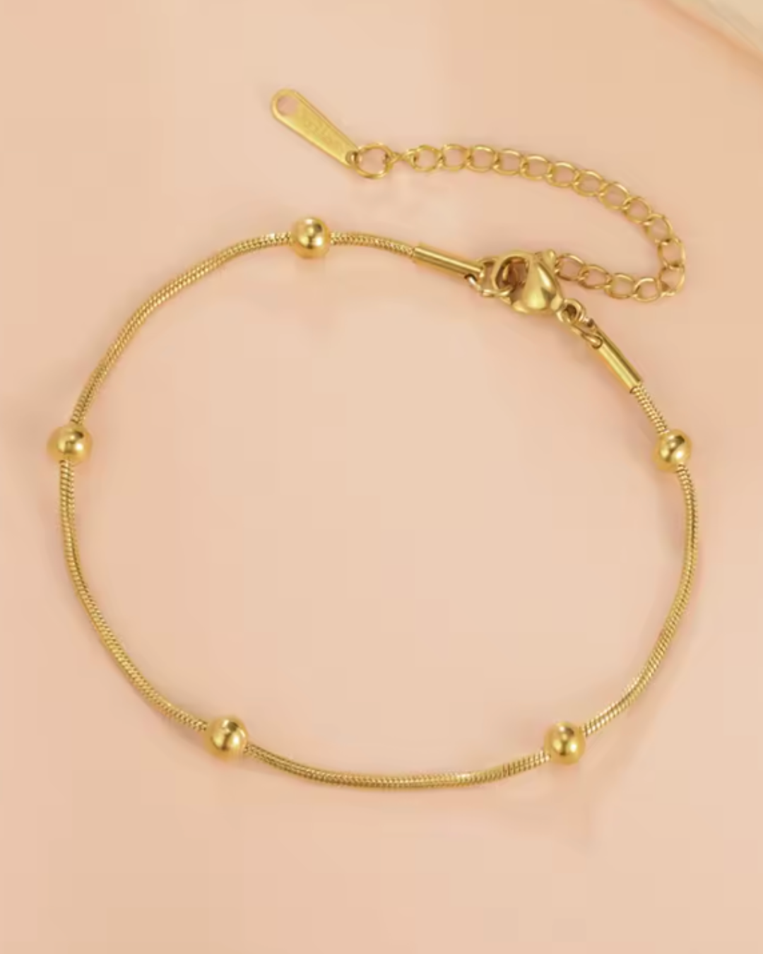 Pulseira Fina com Esferas Douradas